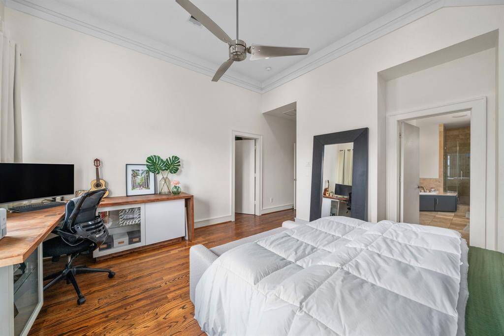 Primary bedroom with a custom desk that stays. Located on 3rd floor.