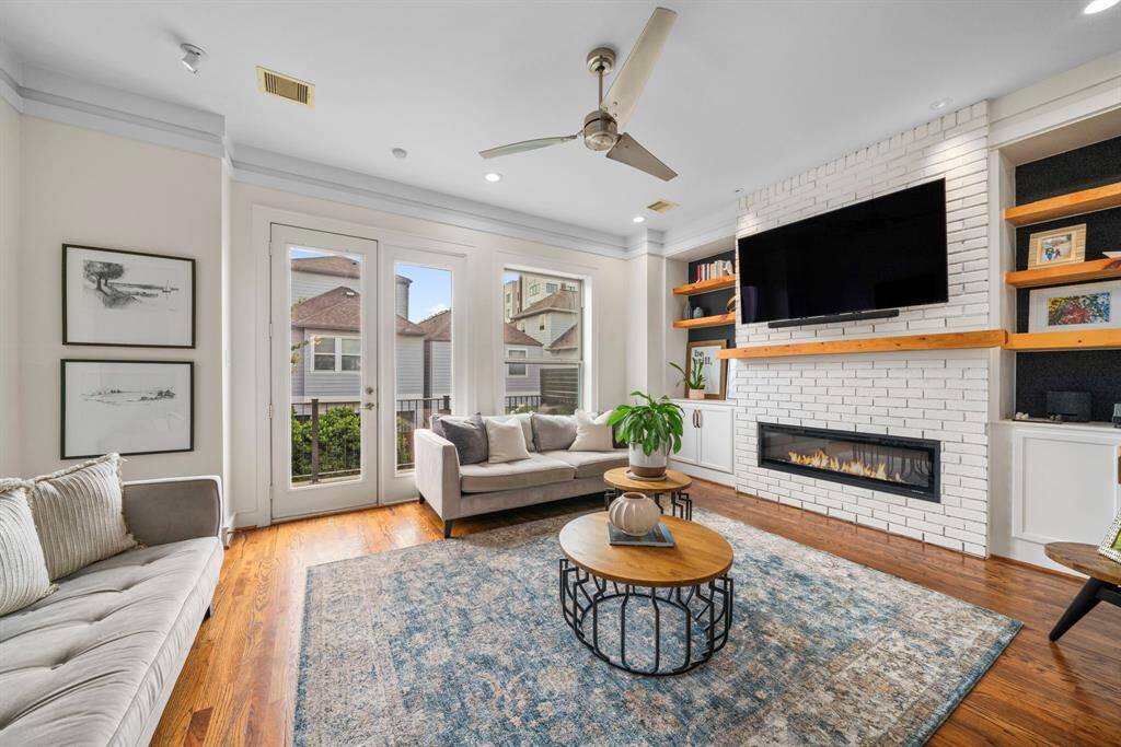 Large open living room with direct access to outdoor balcony.