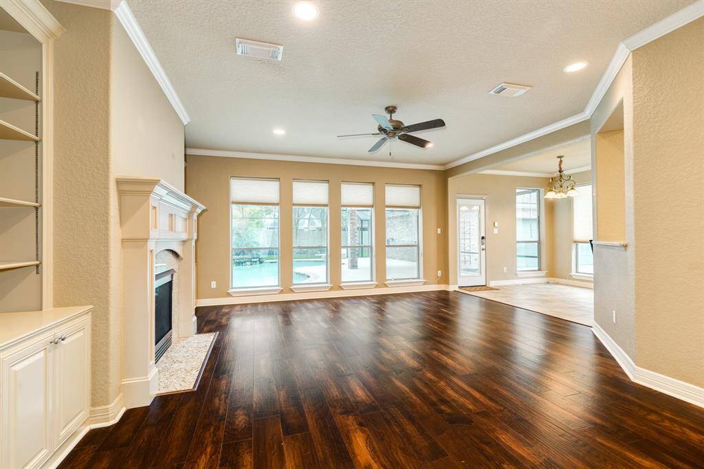 The living area and dining area flow organically into the kitchen all while tons of windows give you plenty of views of the amazing back yard oasis this home offers!  You won't want to cover these windows!