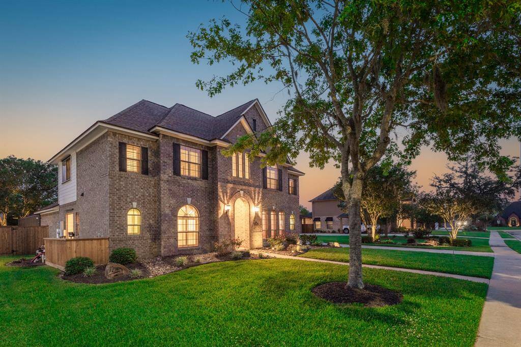 Elegant elevation with timeless brick and high peaked roof give an elevated look to the home upon arrival.