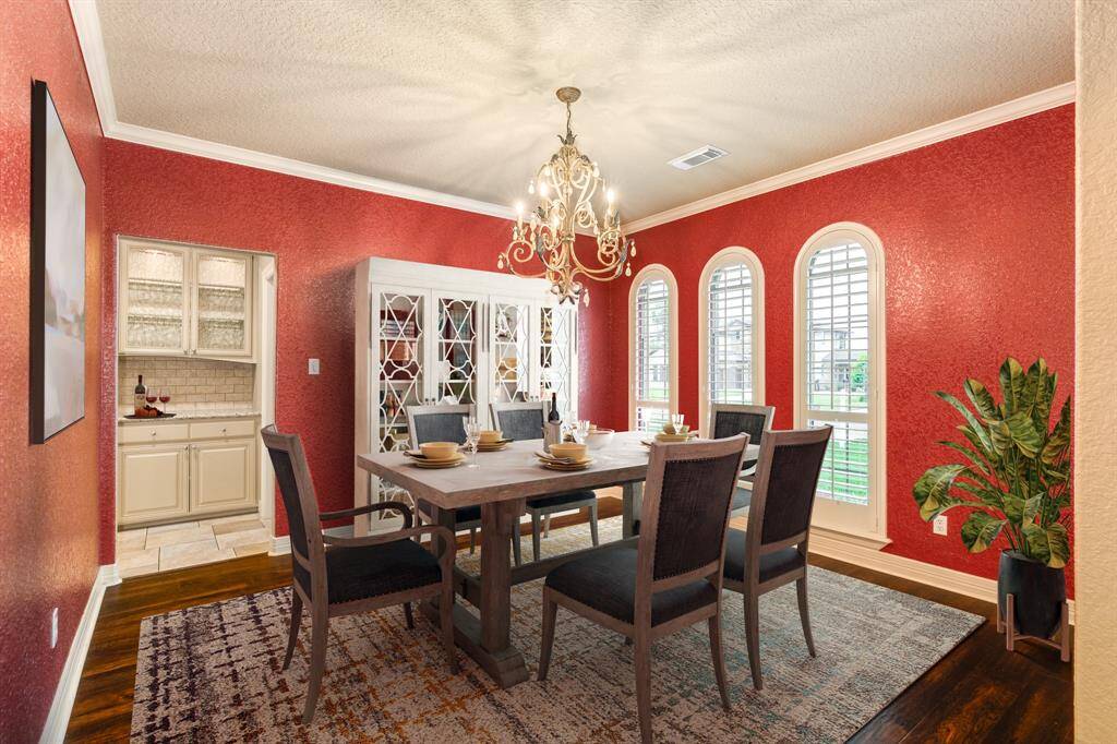 Love hosting big dinners?  This formal dining offers plenty of space for your large dining table perfect for hosting the perfect dinner parties. Plantation shutters on all front windows adding an elevated look to the window treatments.