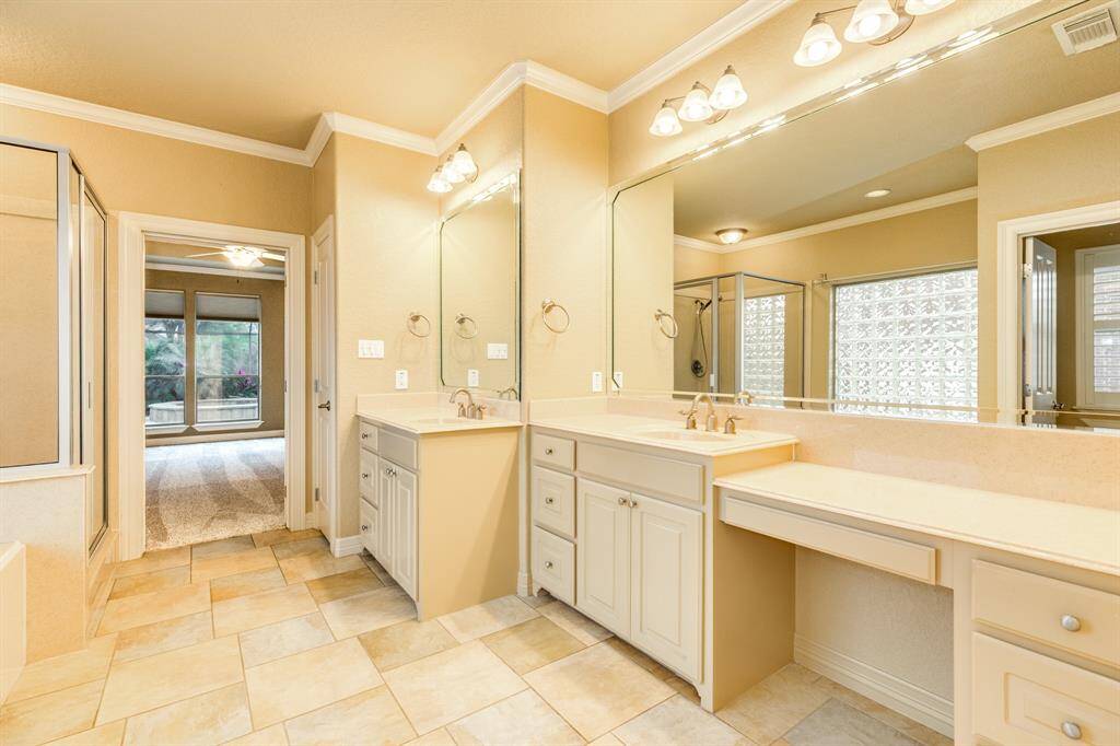The owners en suite offers plenty of storage and dual vanity areas complete with the ideal layout.  No fighting over who's is who's!  Cultured marble line the counter tops keeping this restroom classy and timeless.