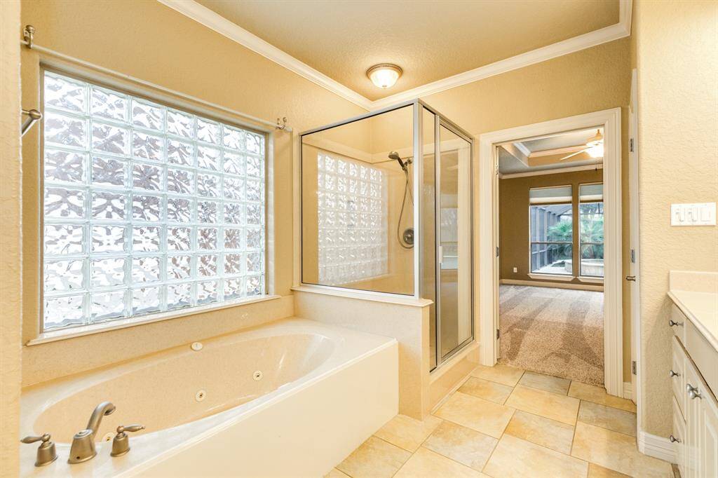 Enjoy soaking after a long day or hard work out in this over sized jacuzzi bath tub. Cultured marble lines the stand in shower with plenty of space for anyone.