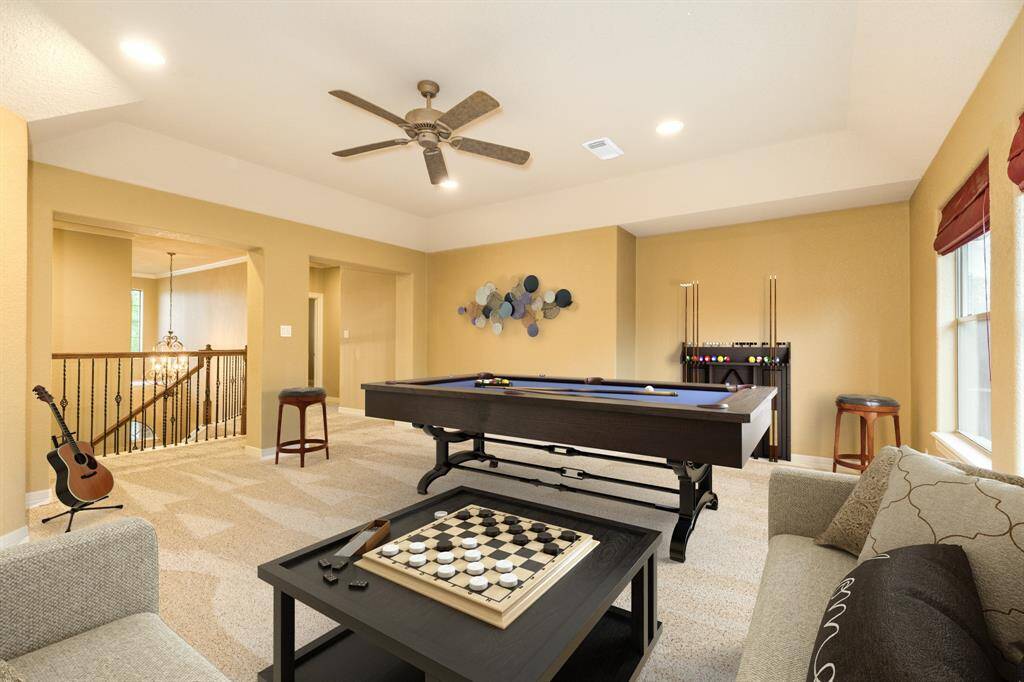 A virtually staged game room to showcase the size and what all can be done with the space.