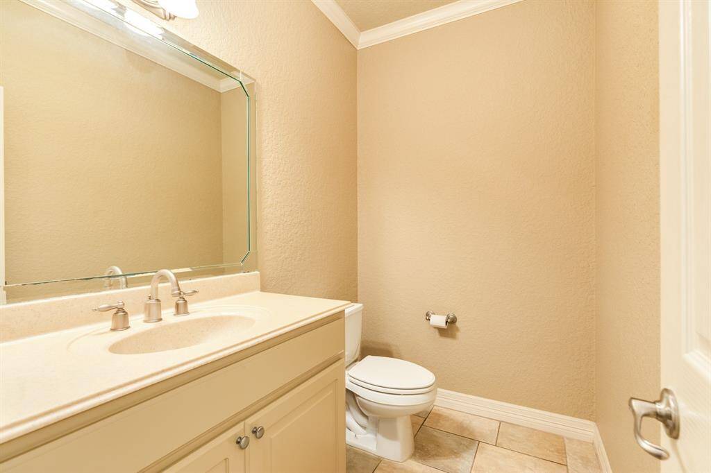 Large half bath located downstairs perfect for guests.