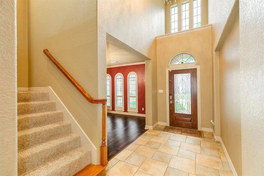 Upon entry you're welcomed by soaring ceilings in the entry way and views of the formal dining and living room. Tons of windows allow natural light to pour through creating a very warm and inviting space.  Pride of homeowner ship is showcased through out this home.