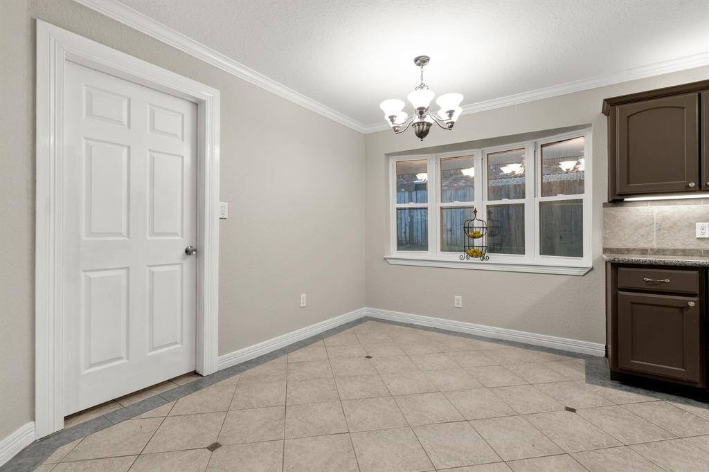 Breakfast area with bay windows and chandelier
