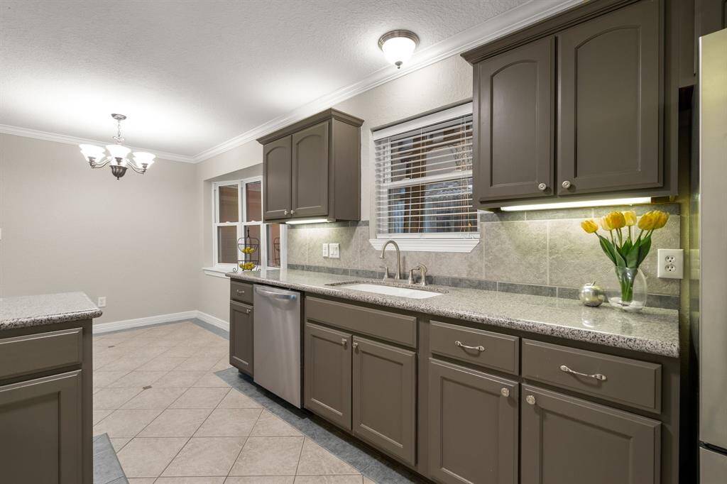 Granite countertops and stainless steel appliances.