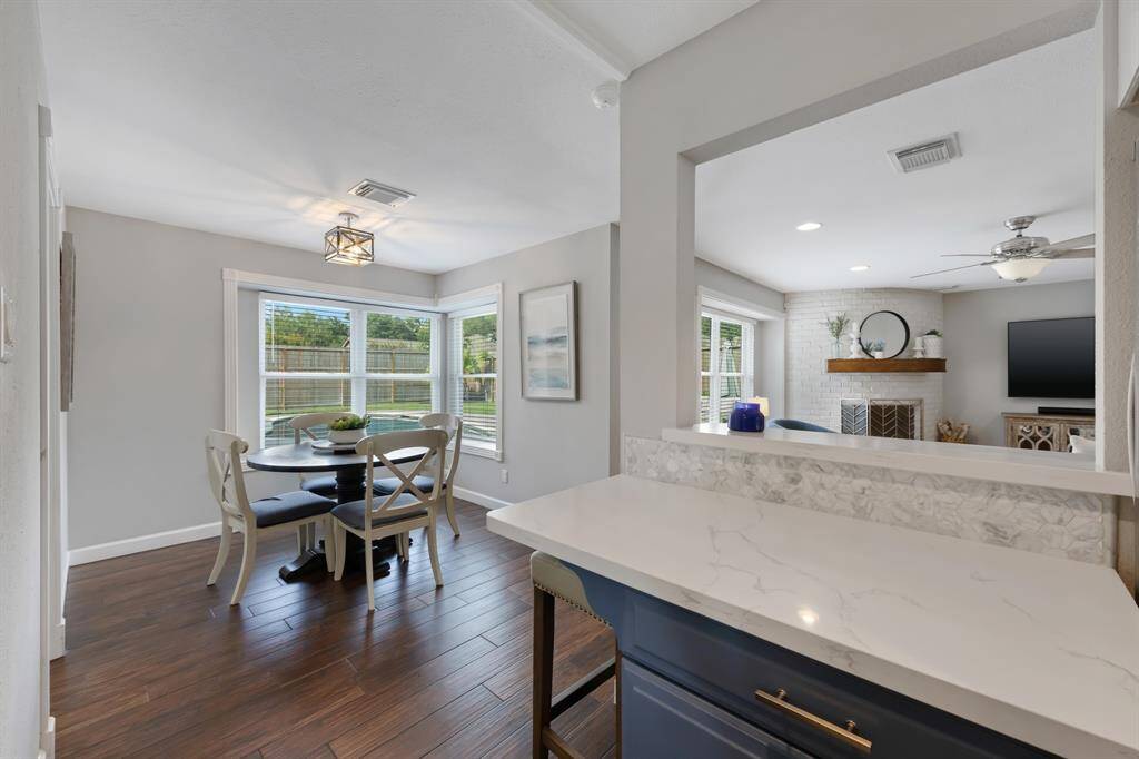 The kitchen connects seamlessly to the family room through a convenient passthrough, ideal for keeping meal and conversations going while cooking!