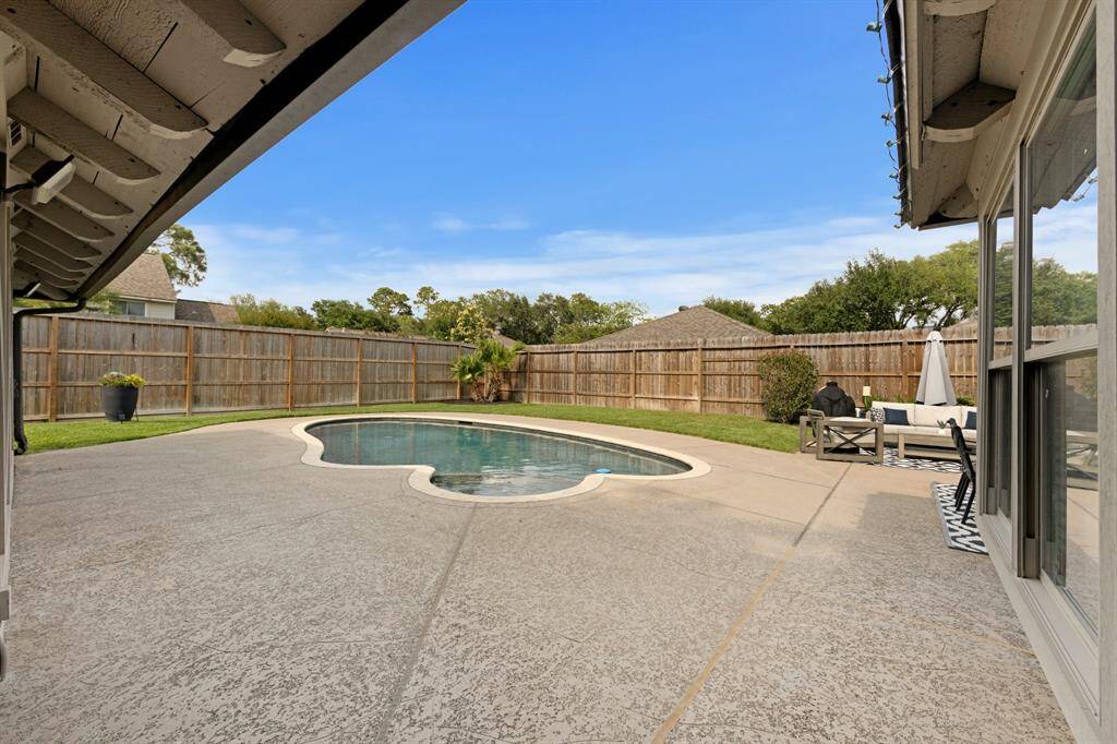 The backyard features a brand new 10’ privacy fence, safety pool netting, and a new energy-efficient pool heater. Ideal for relaxing and entertaining with peace of mind and comfort.