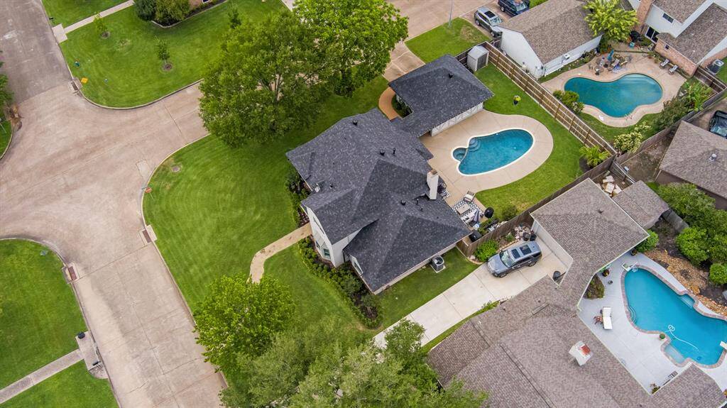 Situated on a spacious corner lot, this beautifully maintained home boasts a private backyard oasis complete with a sparkling pool and covered patio.