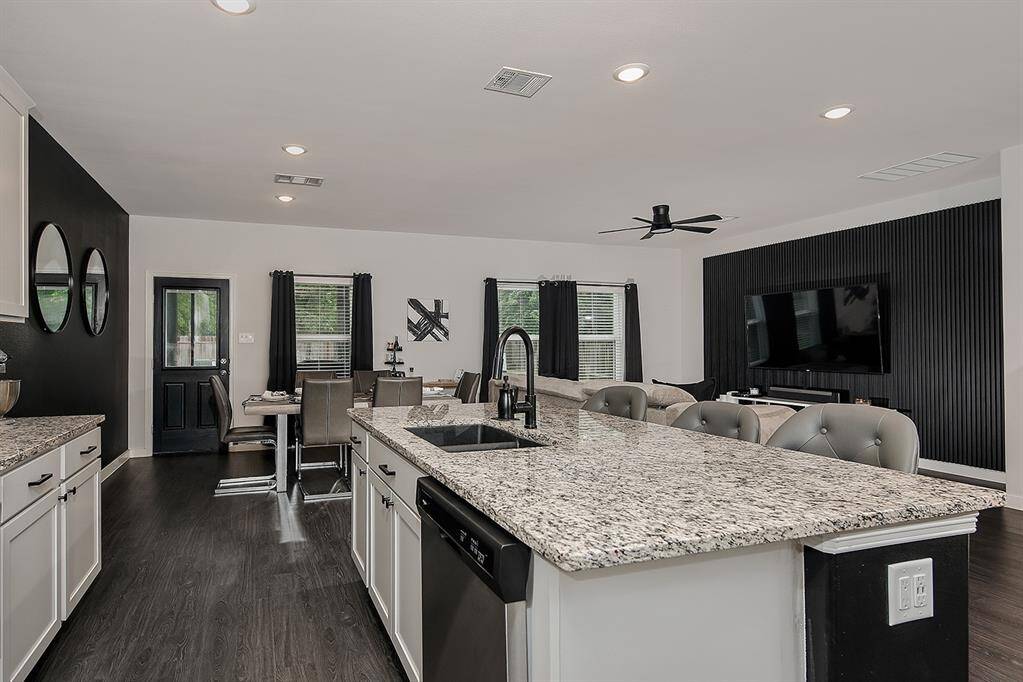 Kitchen overlooks the family room and dining area