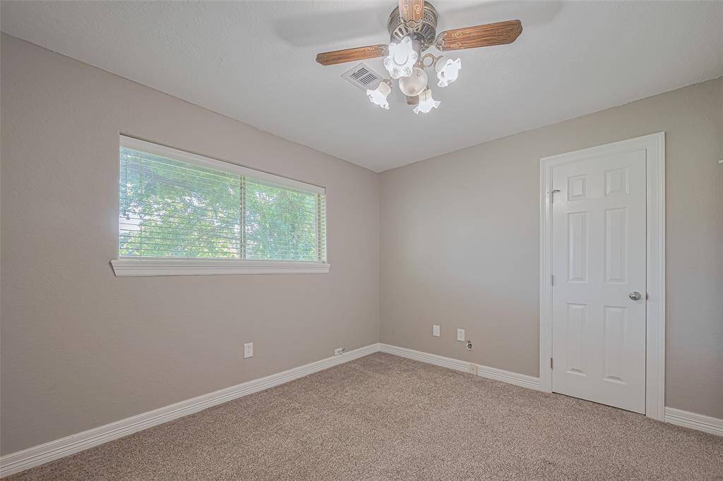 Primary bath features a Upgraded walk-in shower with custom tile and large window for natural lighting