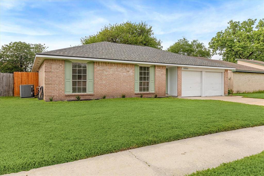 NEWLY REPAINTED EXTERIOR AND BRAND-NEW ROOF SET THE STAGE FOR THIS UPDATED BRICK BEAUTY ON A WELL-MANICURED LOT.