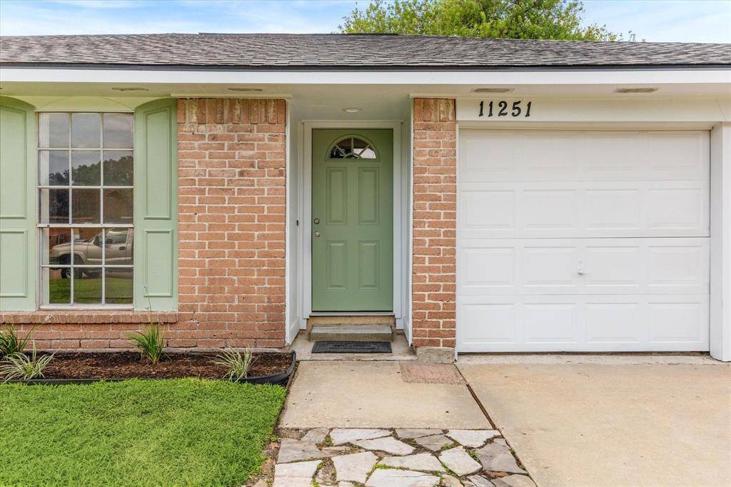 WELCOME HOME TO A FRESHLY PAINTED ENTRYWAY WITH UPDATED FRONT DOOR, TRIM, AND ACCENT SHUTTERS.