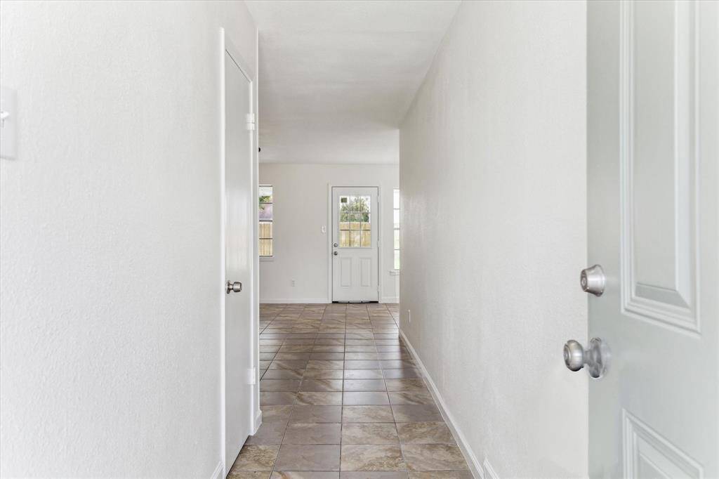 FRESHLY REPAINTED, NEW TILE FLOORING WITH UPDATED A/C & HEATING SYSTEM – ENJOY ENERGY EFFICIENCY FROM THE MOMENT YOU WALK IN.
