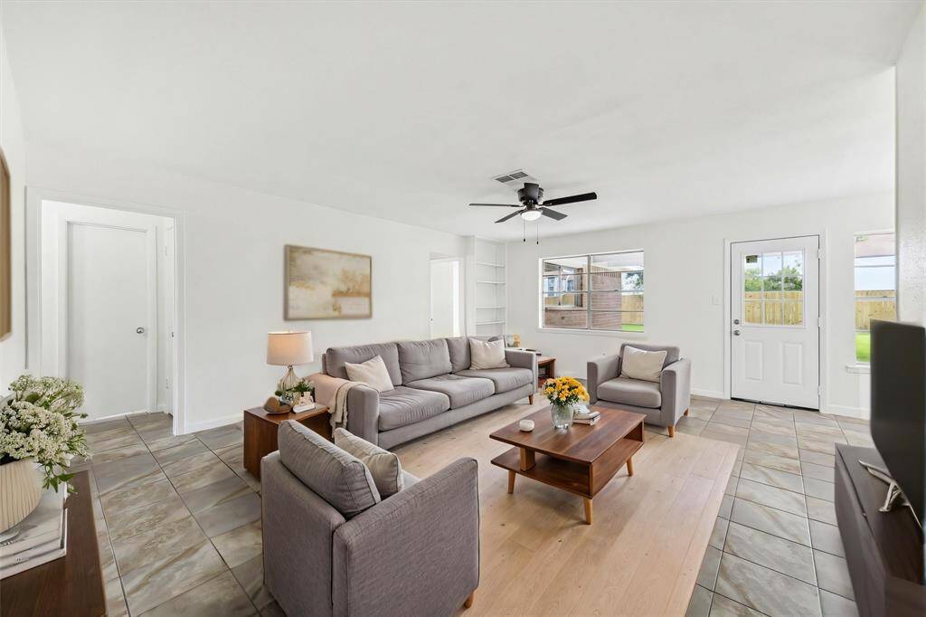 BRIGHT LIVING SPACE WITH NEW A/C VENT COVERS AND CRISP INTERIOR PAINT FOR A CLEAN, UPDATED LOOK. **This room has been virtually staged.