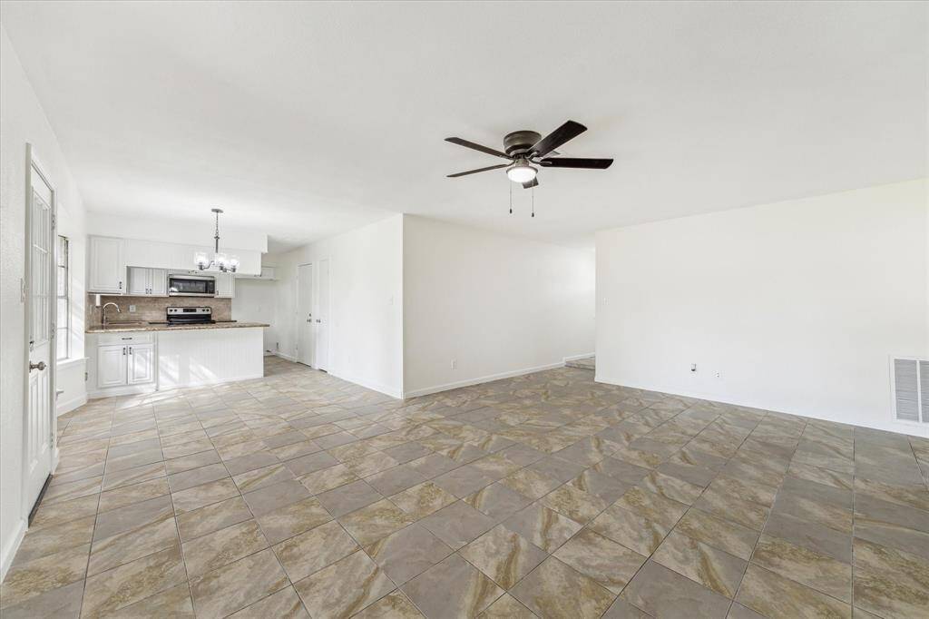 SEAMLESS OPEN FLOOR PLAN CONNECTS THE KITCHEN, DINING, AND LIVING AREAS – IDEAL FOR ENTERTAINING AND EVERYDAY LIVING.