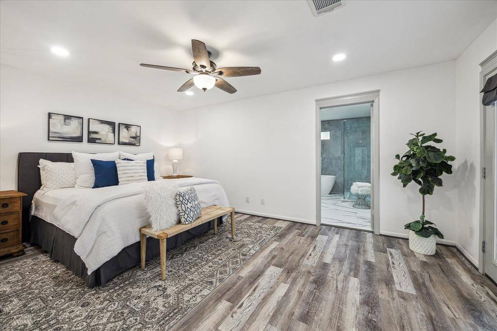 The primary bedroom features an en-suite bathroom and a walk-in closet.