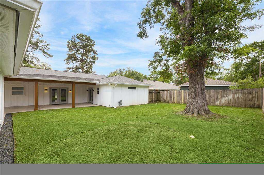 The backyard has ample room for a pool or play equipment. It also features French drains.
