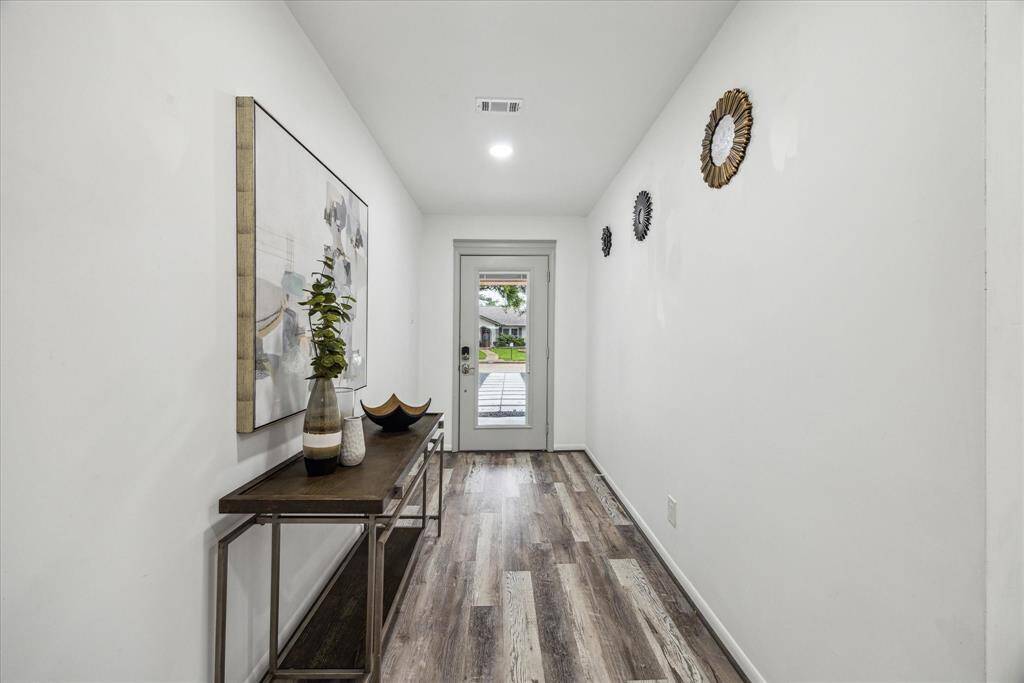 This spacious foyer invites you into your dream home.
