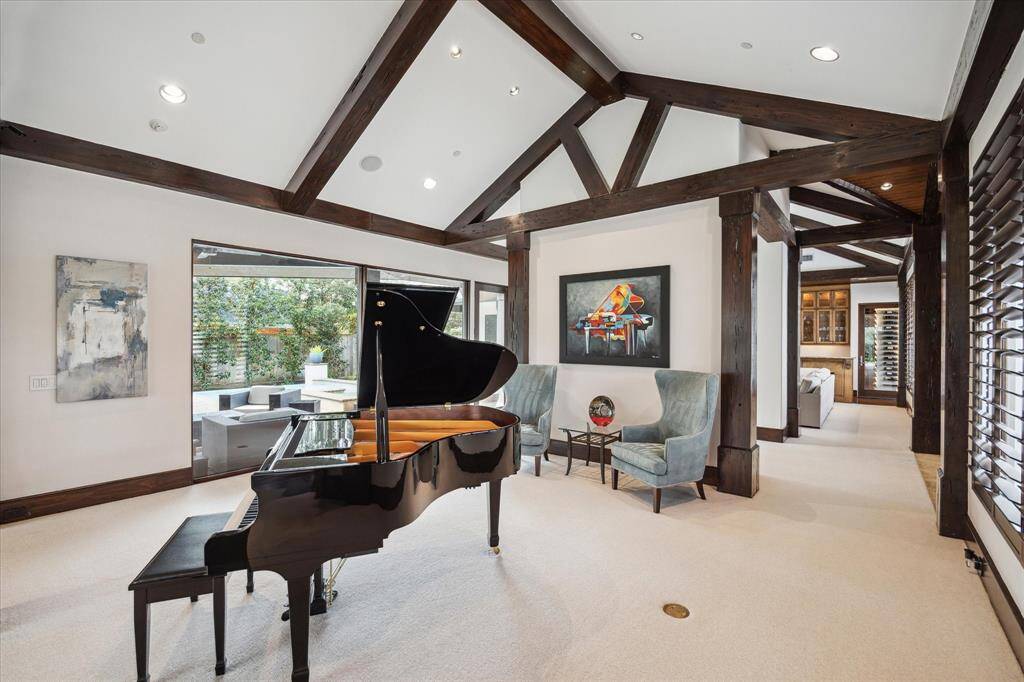Another view showing the access to the foyer and living room/dining/kitchen space.