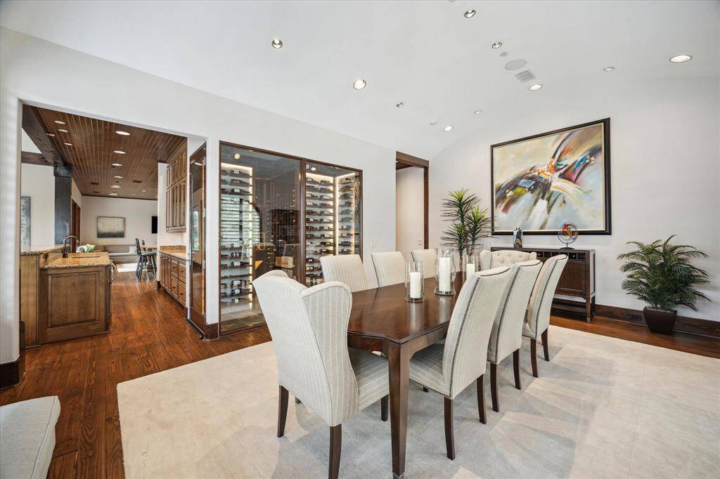 Entertainer's delight with barrel vaulted ceiling, glass wine room, open to the wet bar.