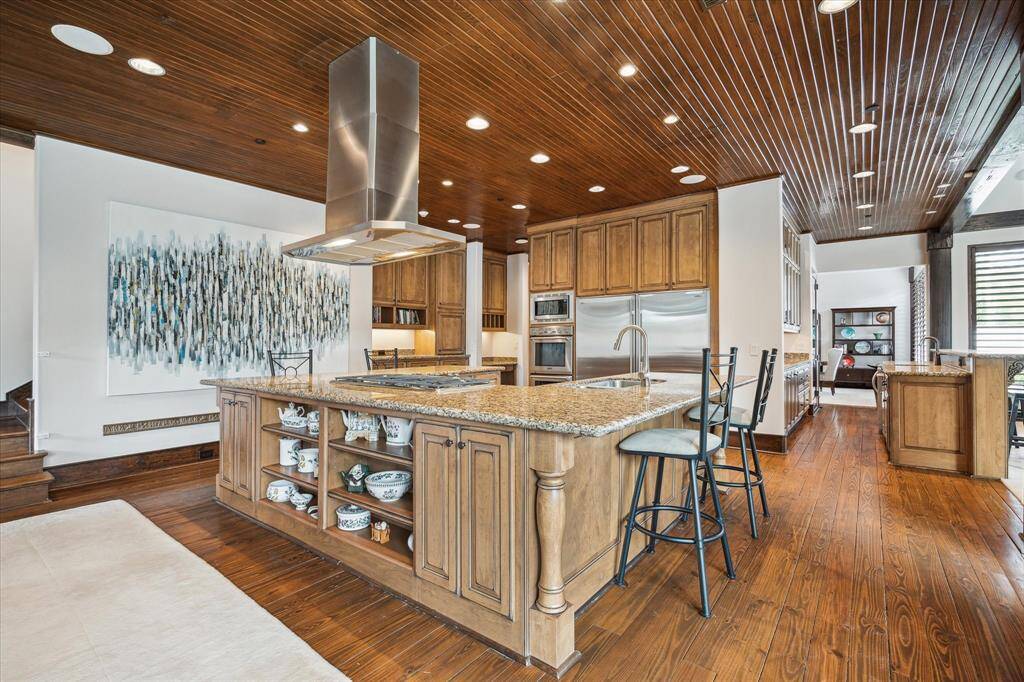Kitchen is central to the Family room, formal living, dining and wet bar/butler's pantry.