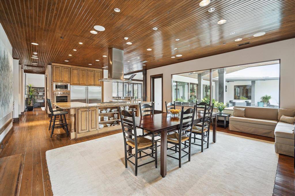 Note the pool views from the family/breakfast room space.