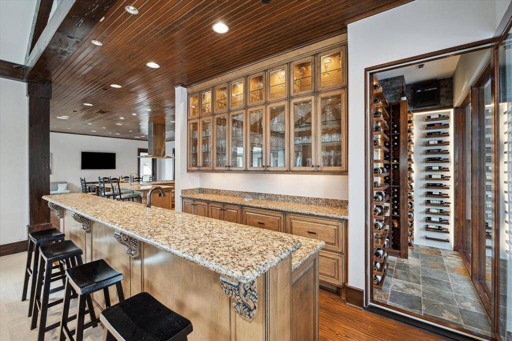 Wet bar/butler's pantry with great storage, glass fronted cabinets with undermount lighting and next to the wine room.