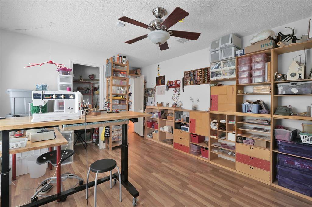 Another view of spacious secondary bedroom currently used as a hobby room.