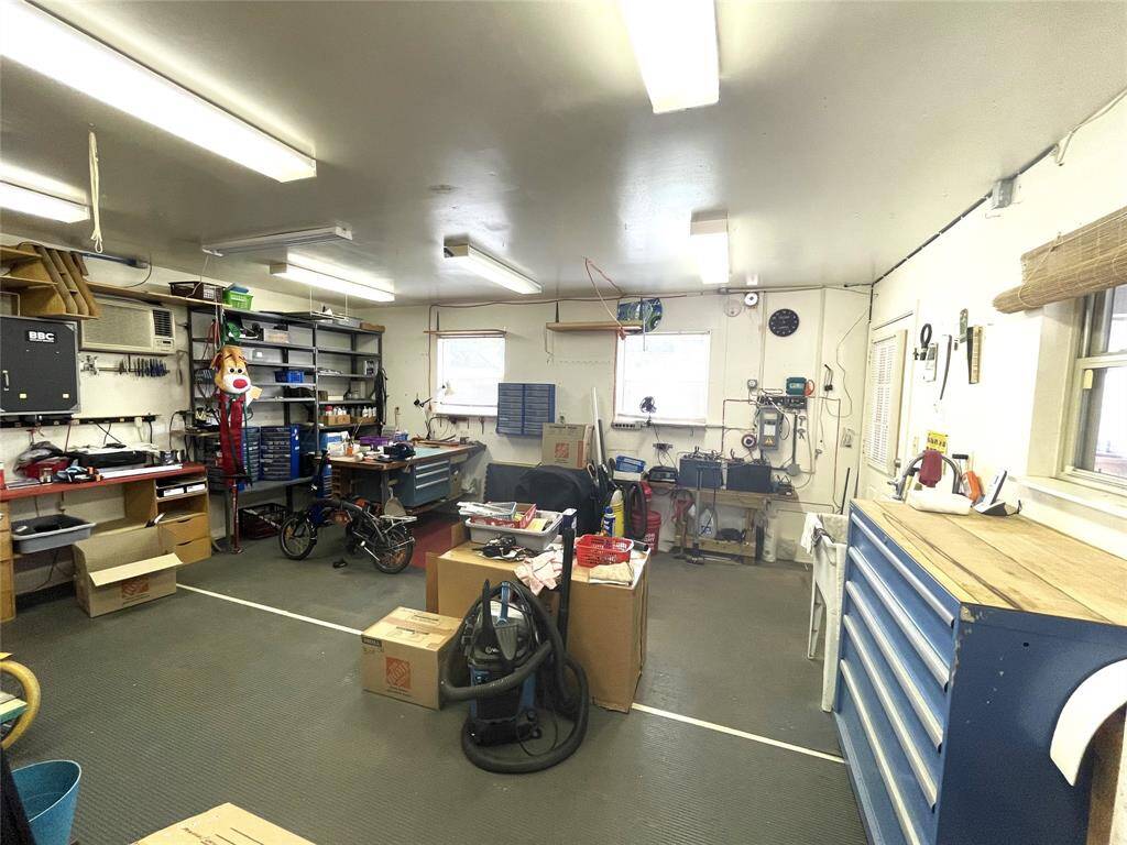 This 16X20 Room adjoins the home and garage. It's climate controlled and currently used as a workshop.