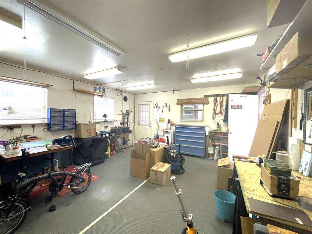 This welcomed flexible space can be a great office, home gym, or workshop as it is now.
