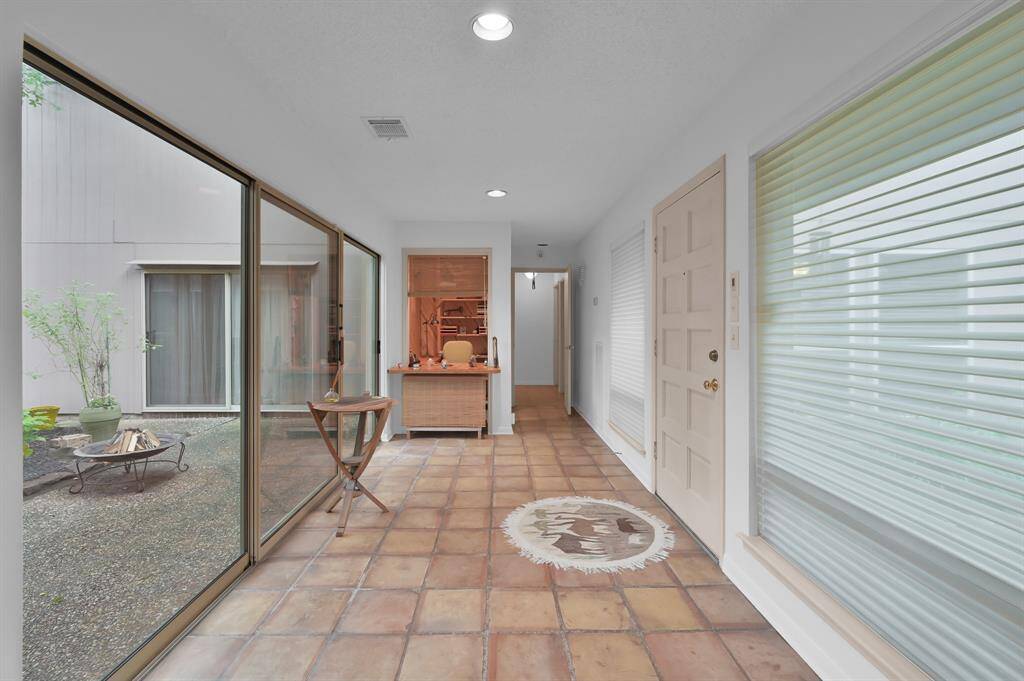 Entry opens to nature of atrium.