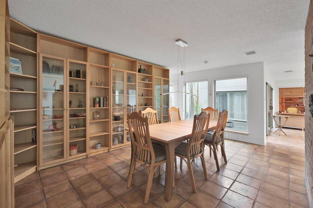 Dining area with large bank of cabinetry