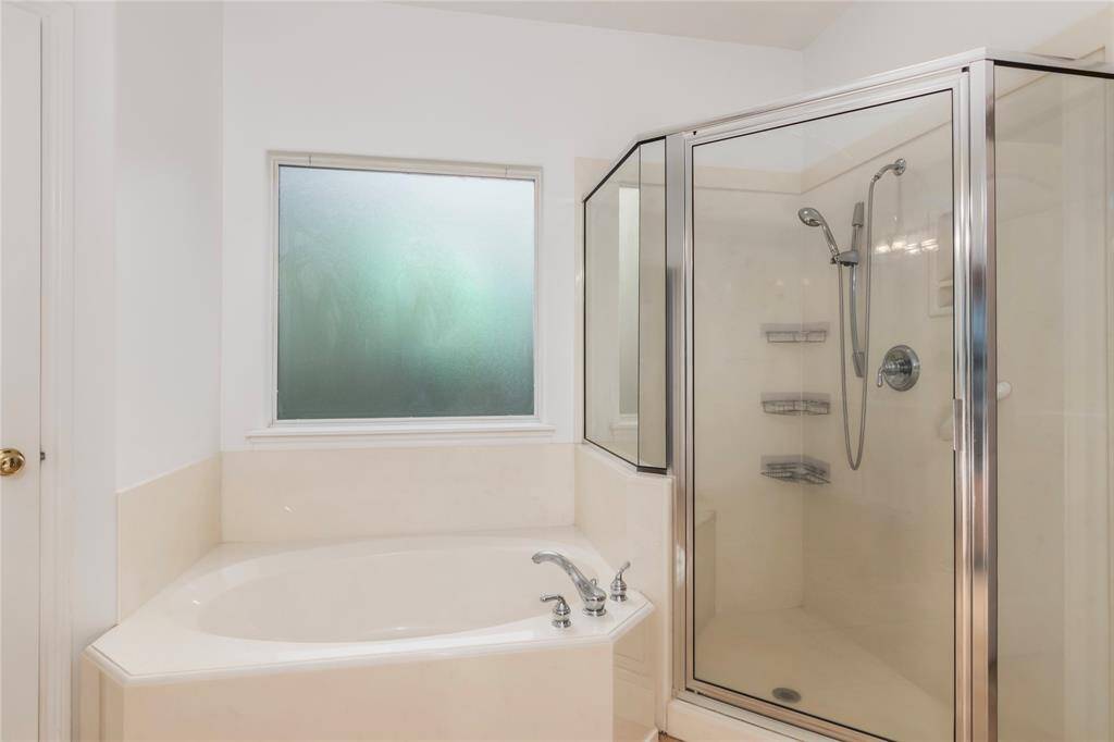 Master bathroom separate shower and tub.