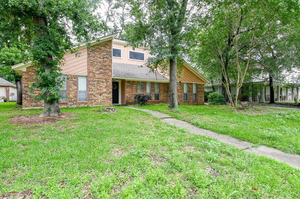 Generous lot with mature trees in well sought after community close to The Woodlands
