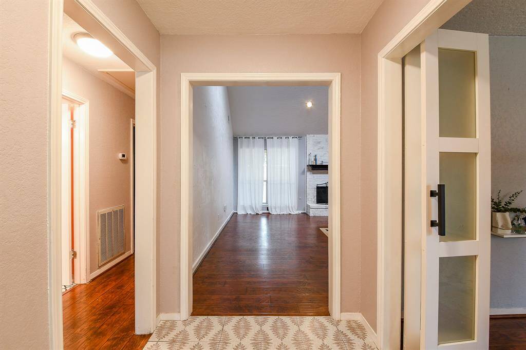 Large foyer flanked with french doors to the home office on the right.