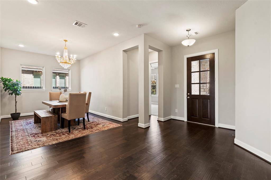 "Grand open entryway, high ceilings, and natural light set a regal tone."