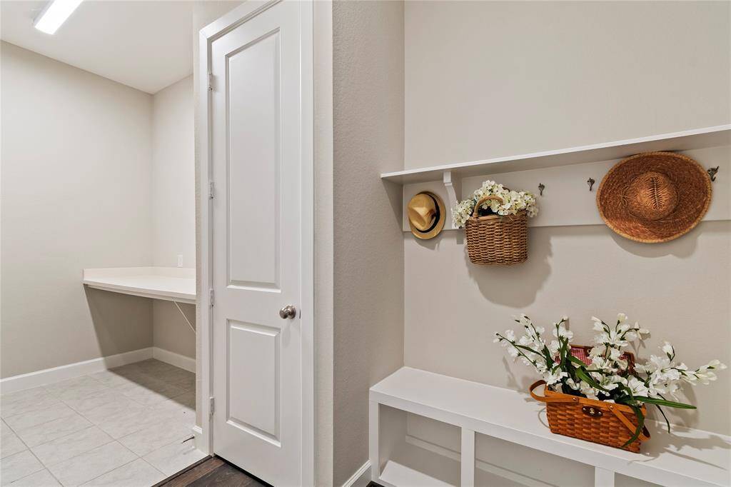 "Practical mudroom seamlessly connects the garage and laundry room, keeping your home organized and clutter-free."