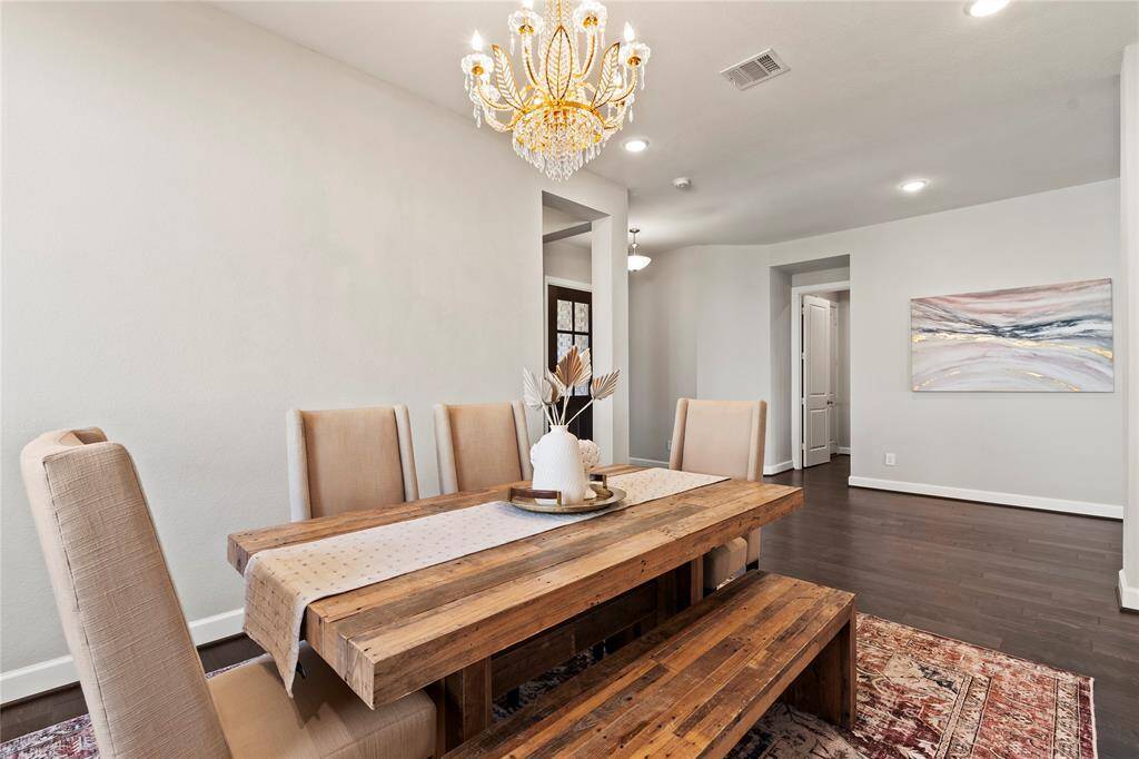 "Elegant dining room, adjacent to the kitchen, with open flow for entertaining."