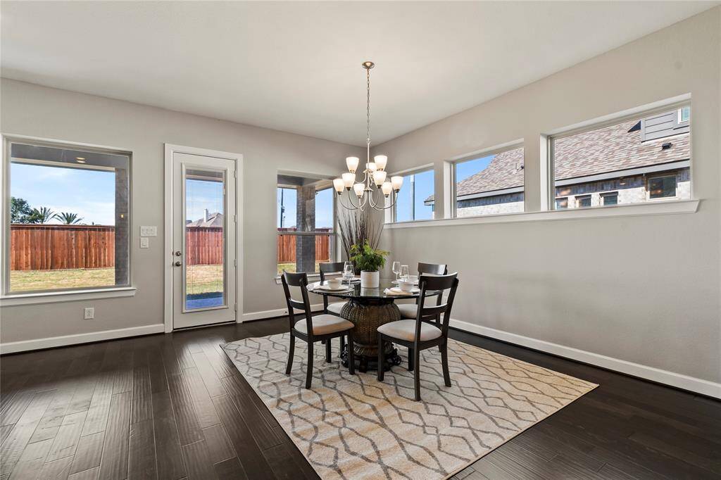 Breakfast Nook"Bright breakfast nook with large windows, open to the living room and fireplace."