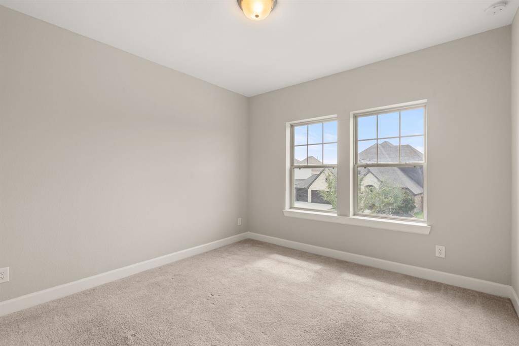 Bright Bedroom with ceiling fan and windows