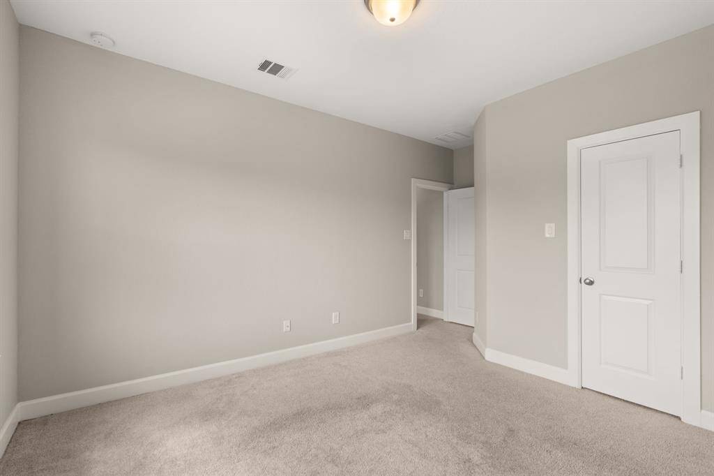 spacious room with neutral colors