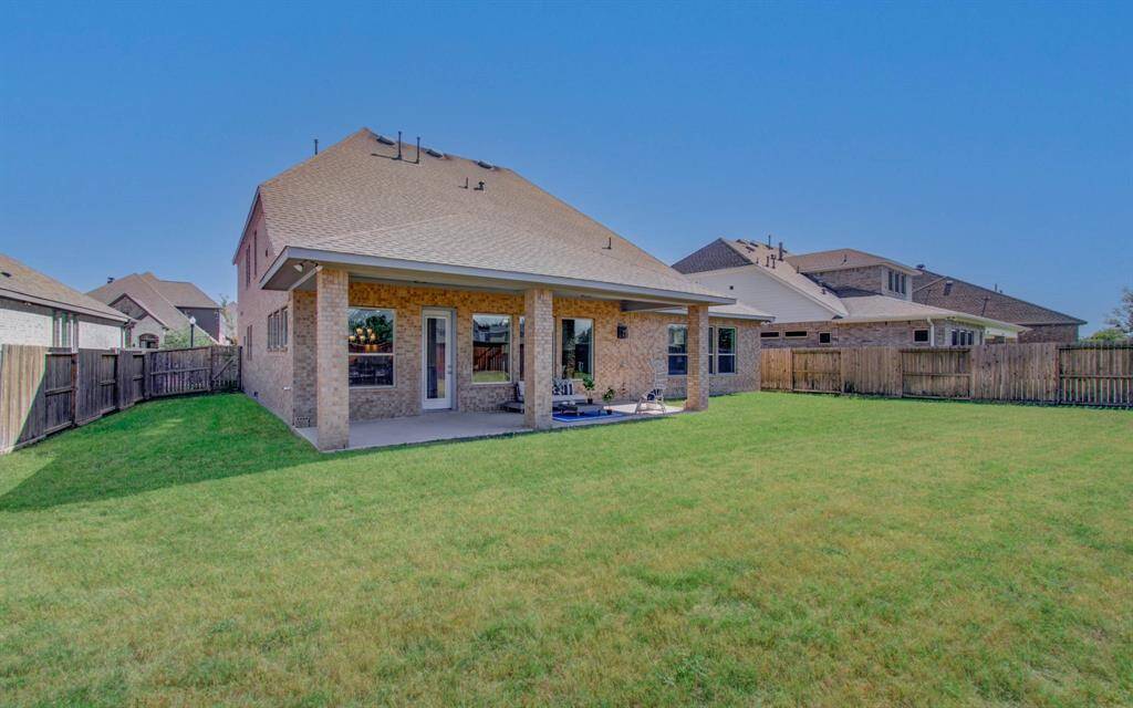 "Serene backyard retreat with space for entertaining or relaxing."
