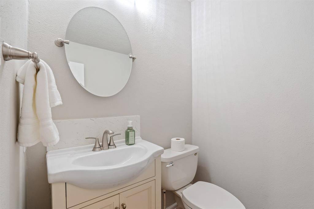 Guest half bath is downstairs near the kitchen.
