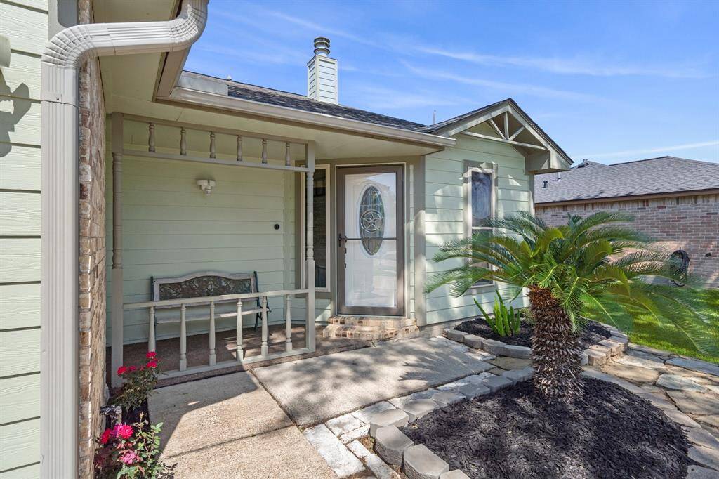 This charming home starts in the front with it's quaint porch.