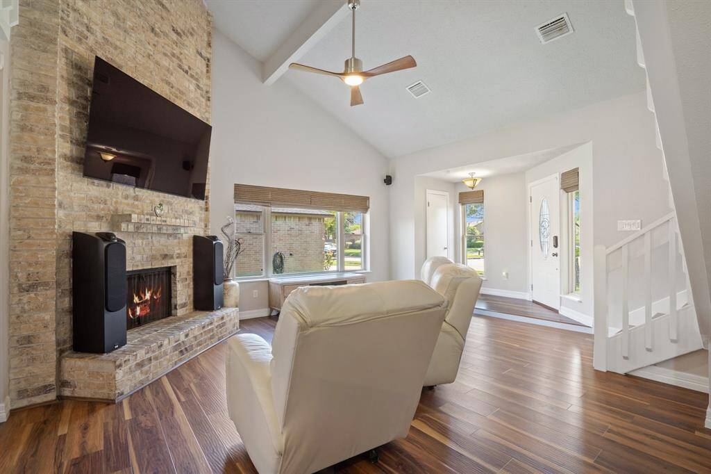 Family room sits just off the front of the home and can accommodate different layouts of furniture with couches and/or chairs and coffee table.