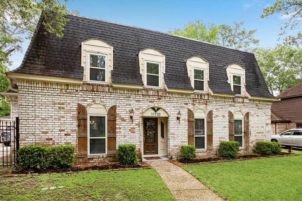 With warm natural tones and classic wood shutters, this Lakewood Forest gem exudes timeless charm and curb appeal. Step inside to discover light-filled living spaces, elegant design details, and a backyard oasis complete with a sparkling pool.