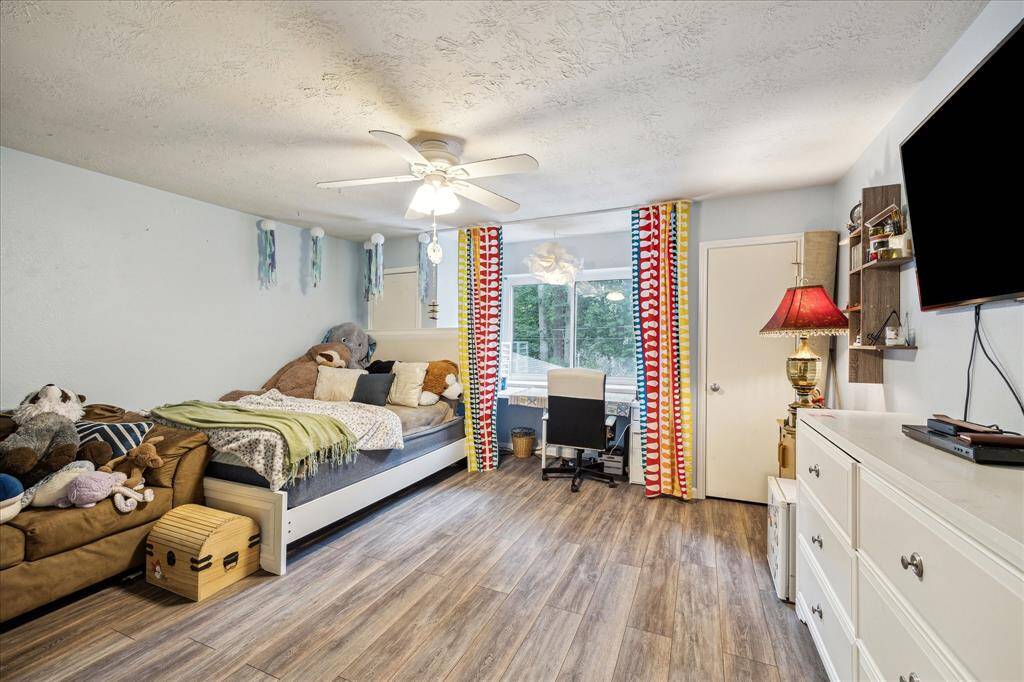 This oversized secondary bedroom offers incredible space and comfort, featuring two walk-in closets and a private en suite bathroom complete with a walk-in shower. Perfect for guests, teens, or multi-generational living!